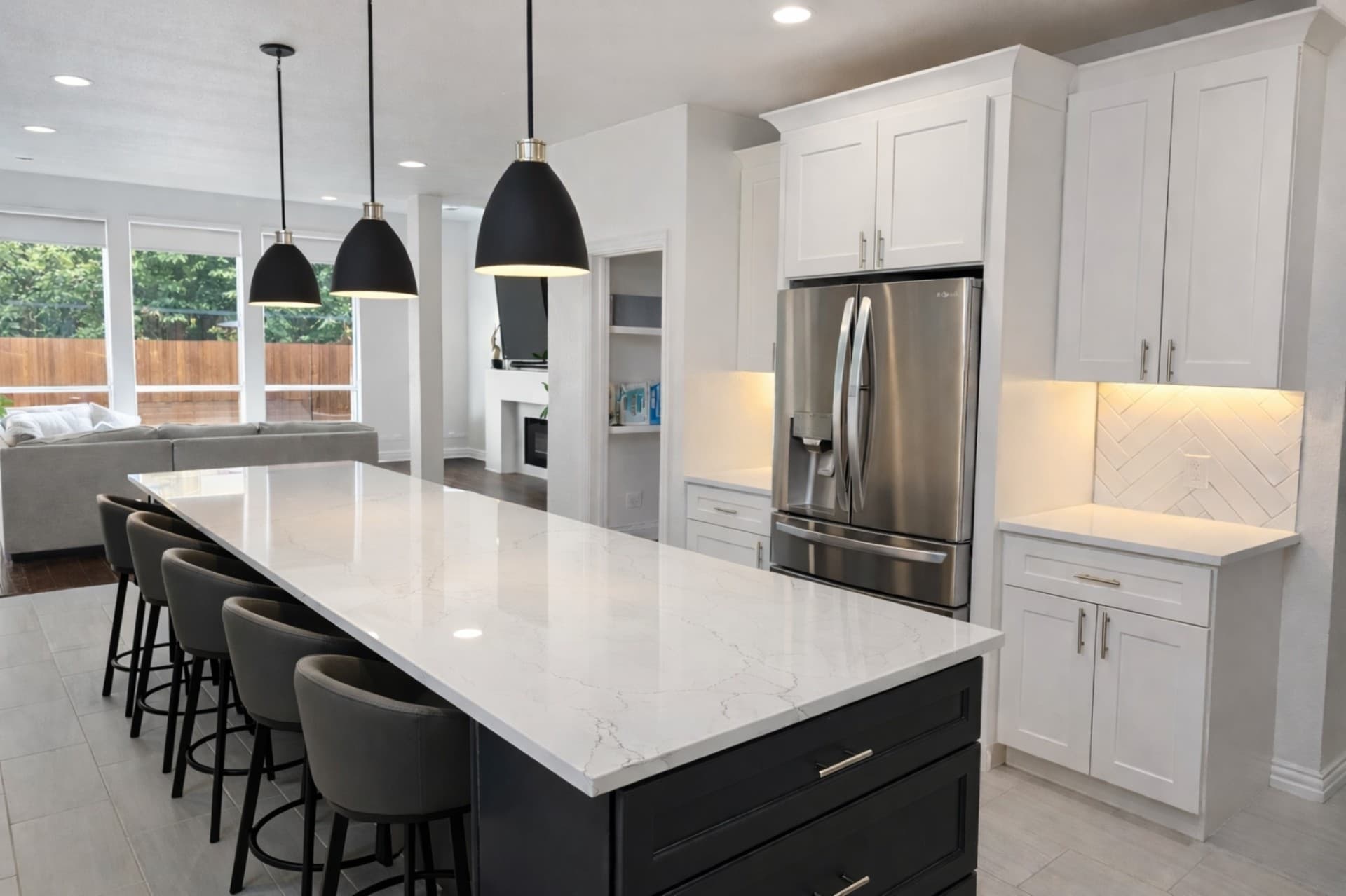 Renovated open-concept kitchen with custom cabinetry and quartz island in Dallas-Fort Worth