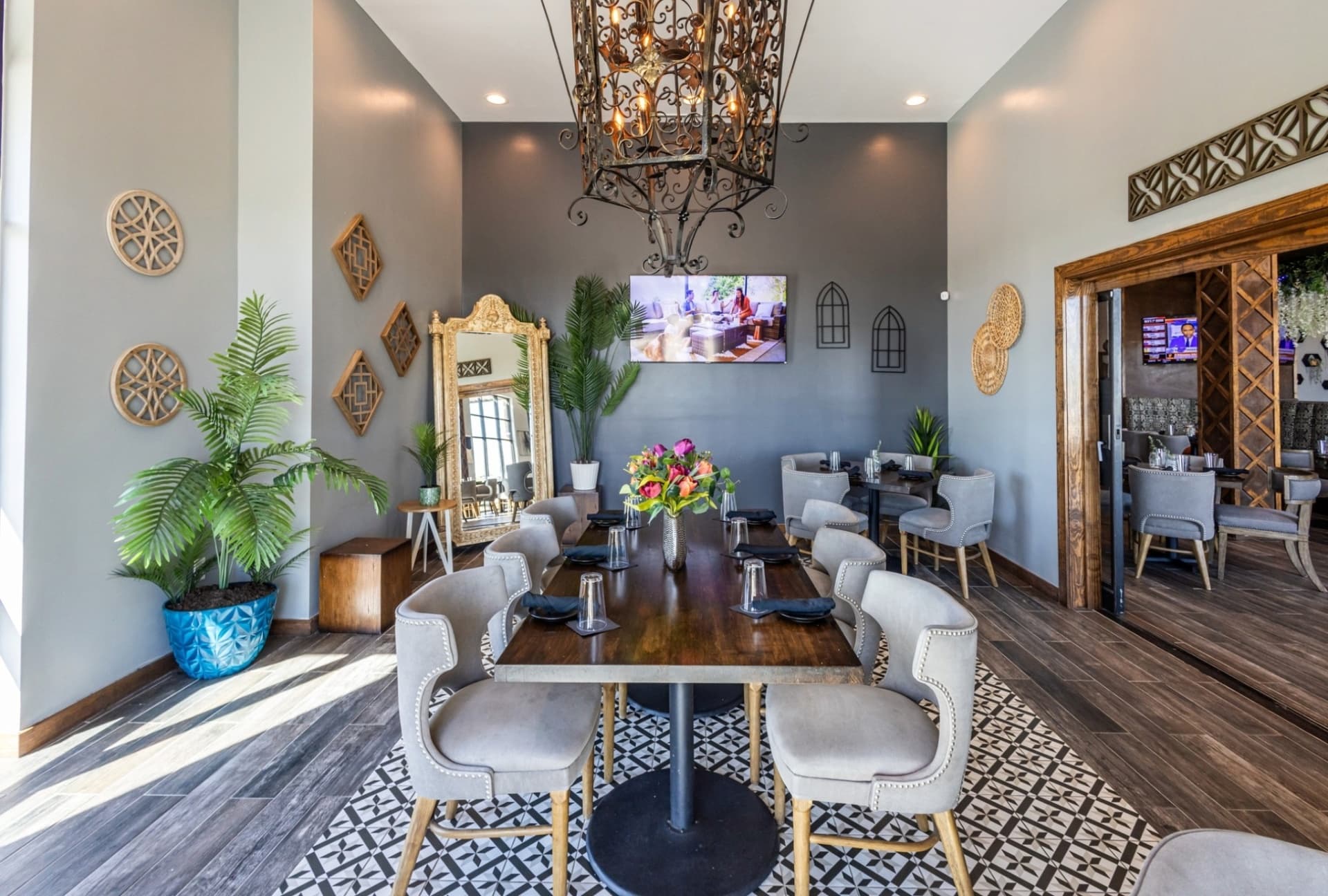 Private dining room with chandelier and accent wall