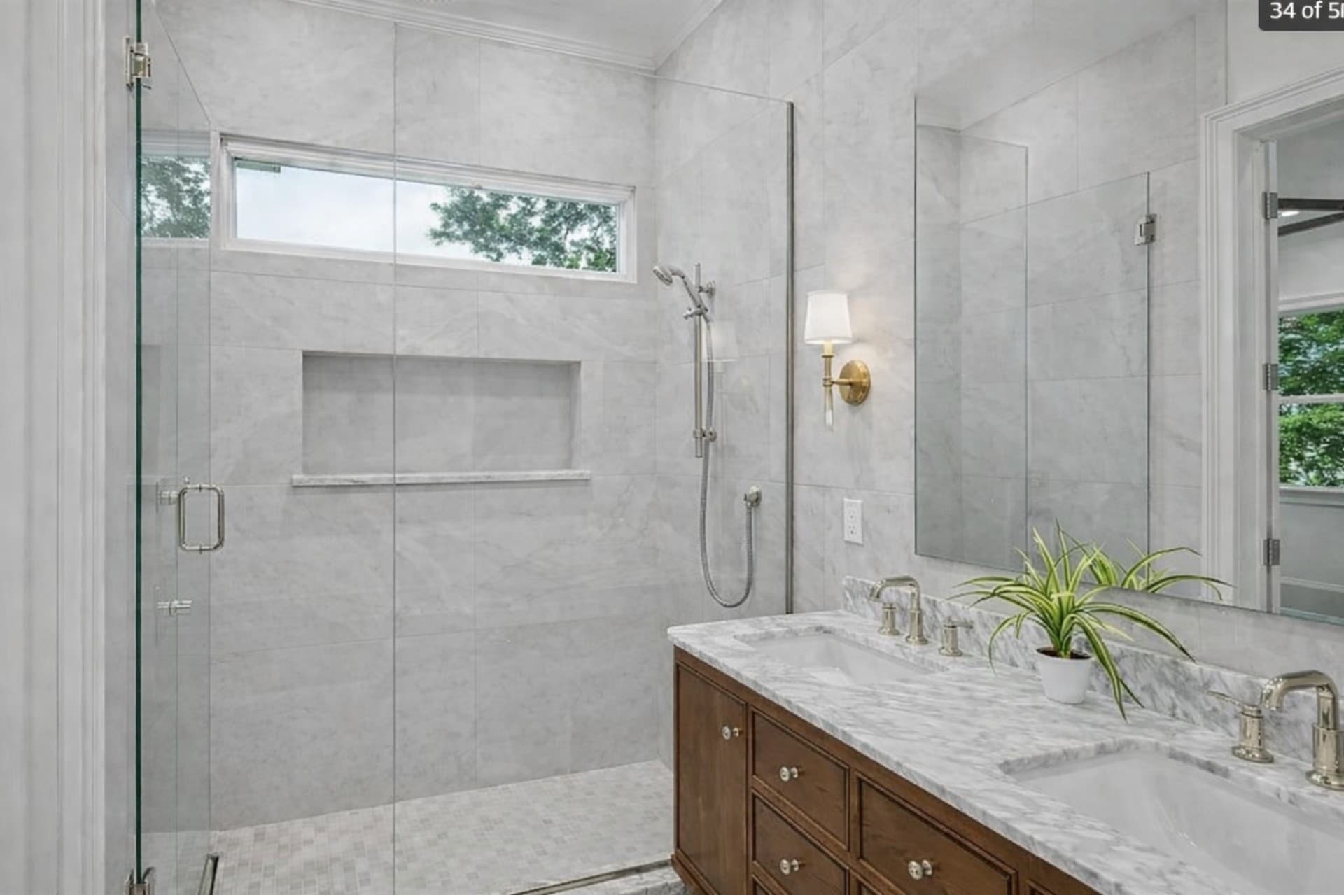 Bluff View Dallas bathroom remodel walk-in shower with double vanity