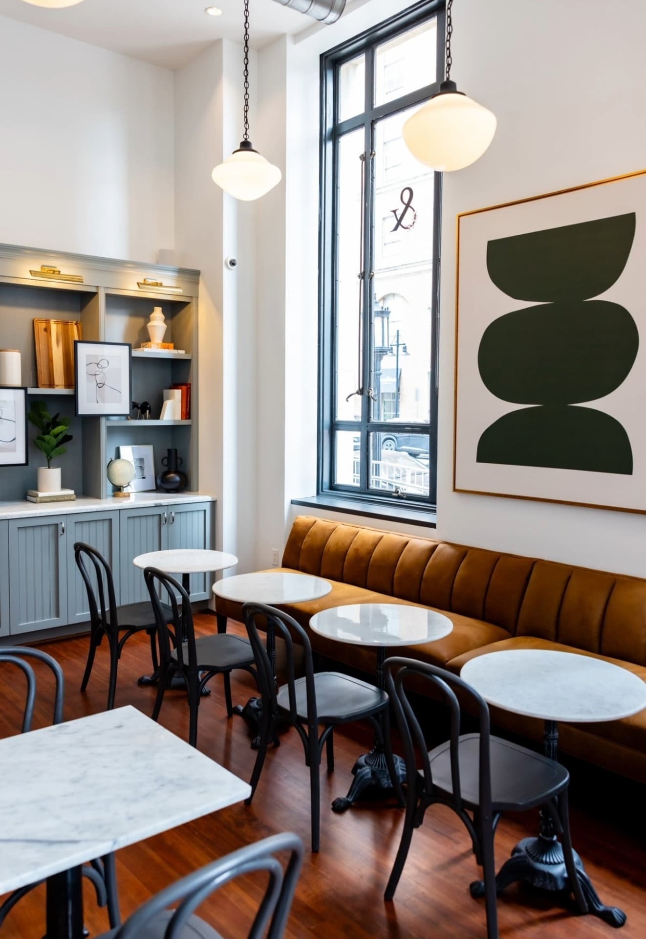 Boxed and Brewed cafe seating with custom millwork and art
