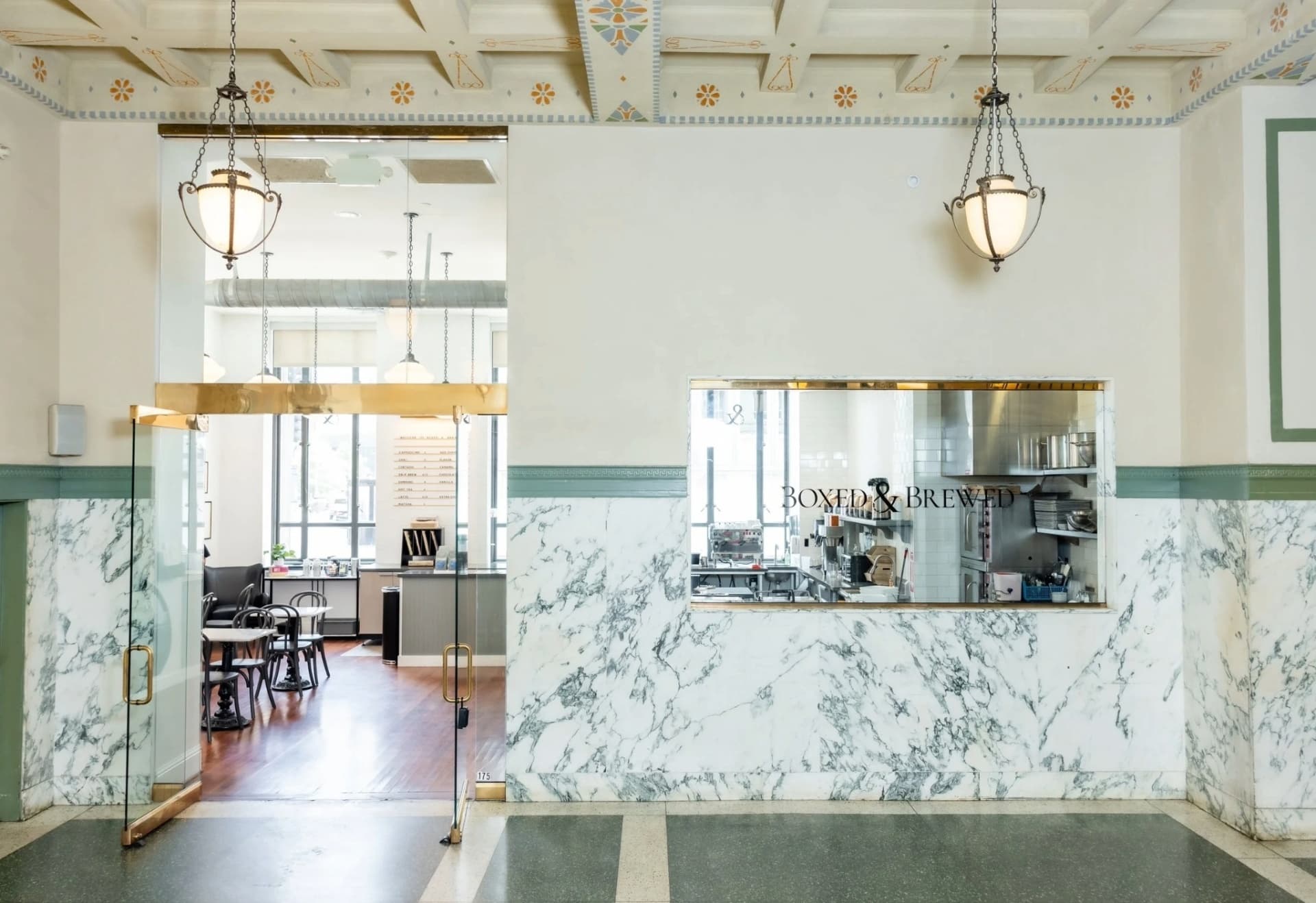 Boxed and Brewed restaurant entry marble facade 400 N Ervay Dallas TX