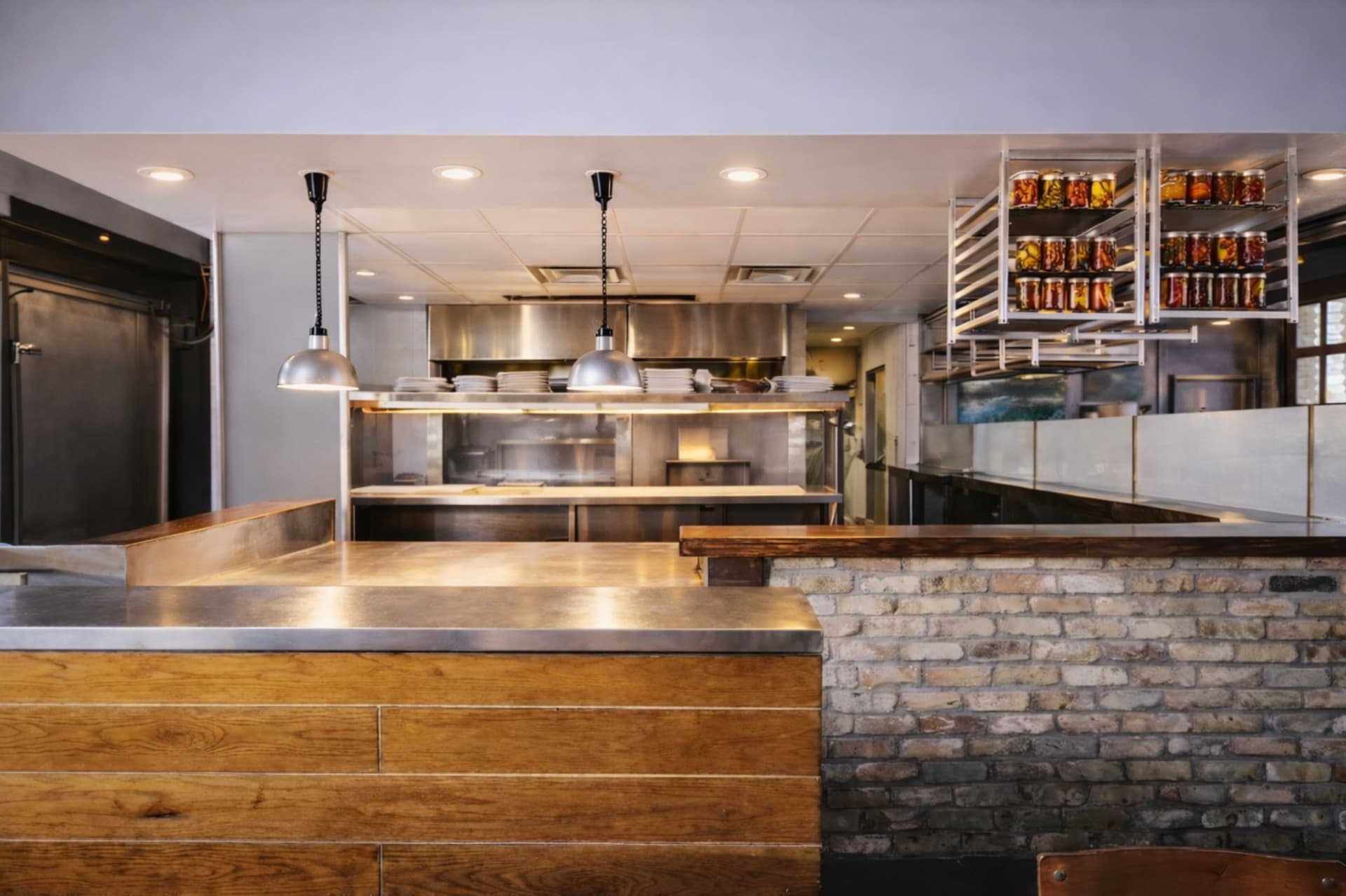 Encina restaurant open kitchen pass window with brick counter detail