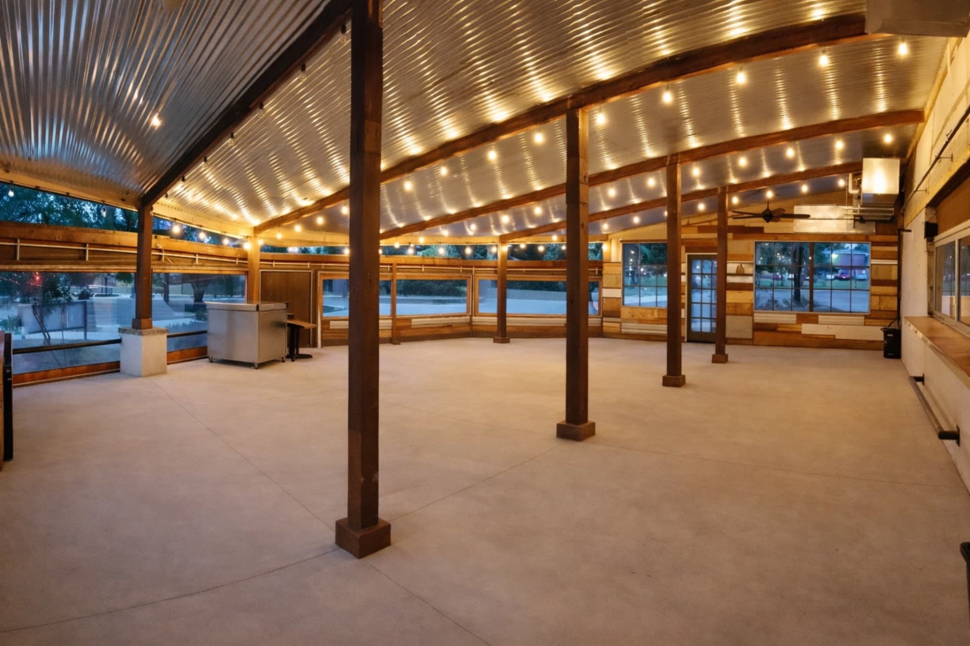 Encina restaurant covered patio with string lights and timber framing