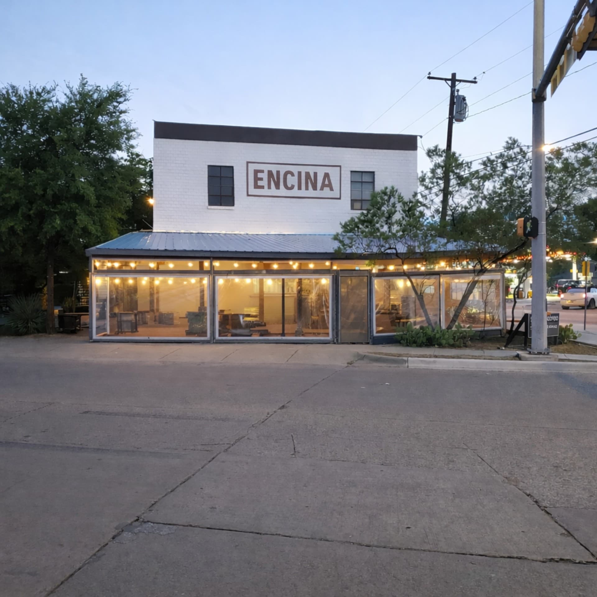 Encina restaurant exterior signage at dusk Oak Cliff Dallas TX