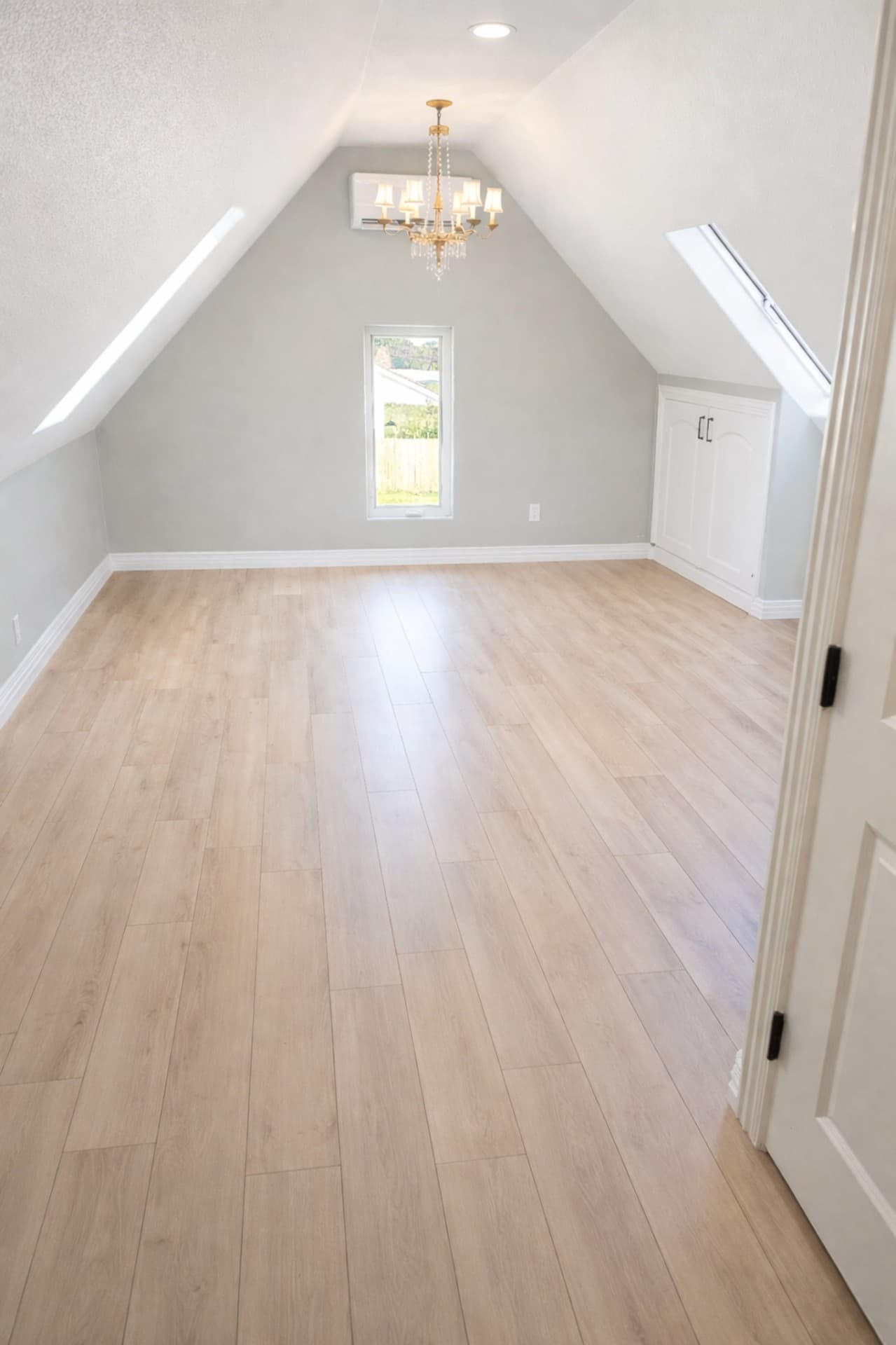 Grapevine TX attic conversion hallway with runner rug and sloped ceilings