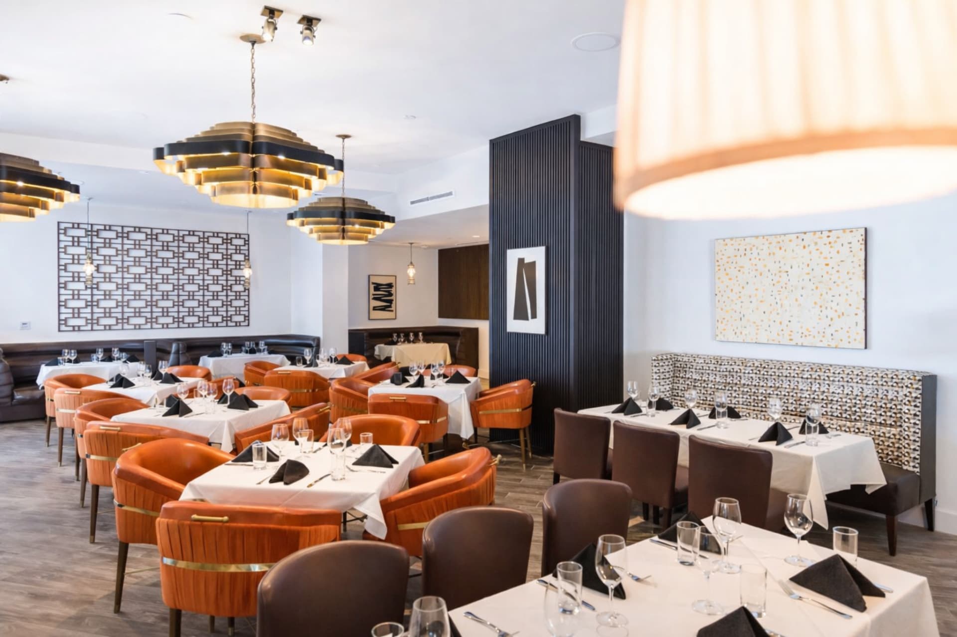 LVI Steak House dining room with art deco chandeliers and leather seating