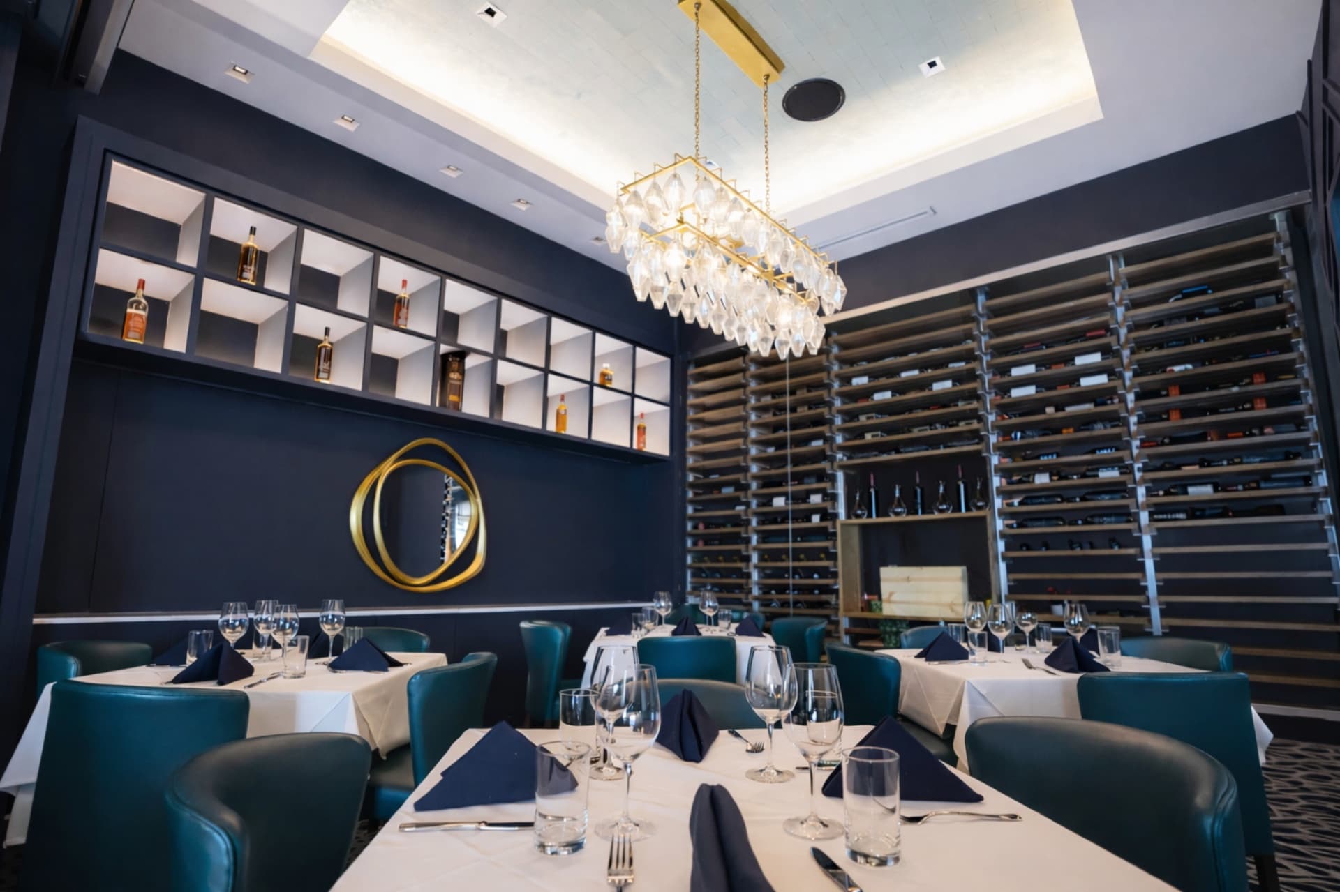 LVI Steak House upscale interior with wine wall and custom lighting