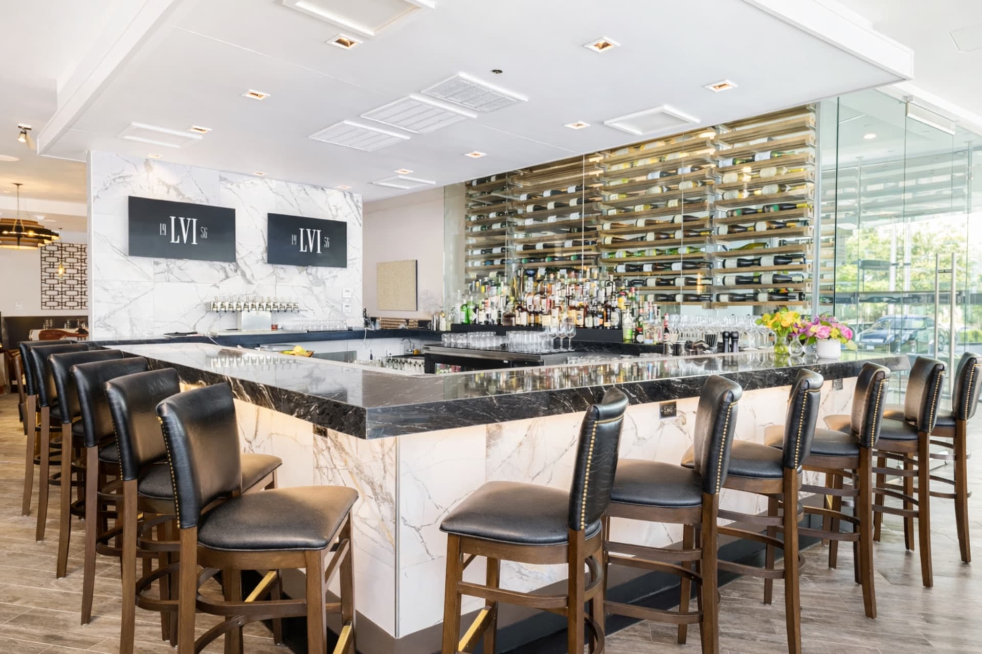 LVI Steak House marble bar with wine display Statler Hotel Dallas TX