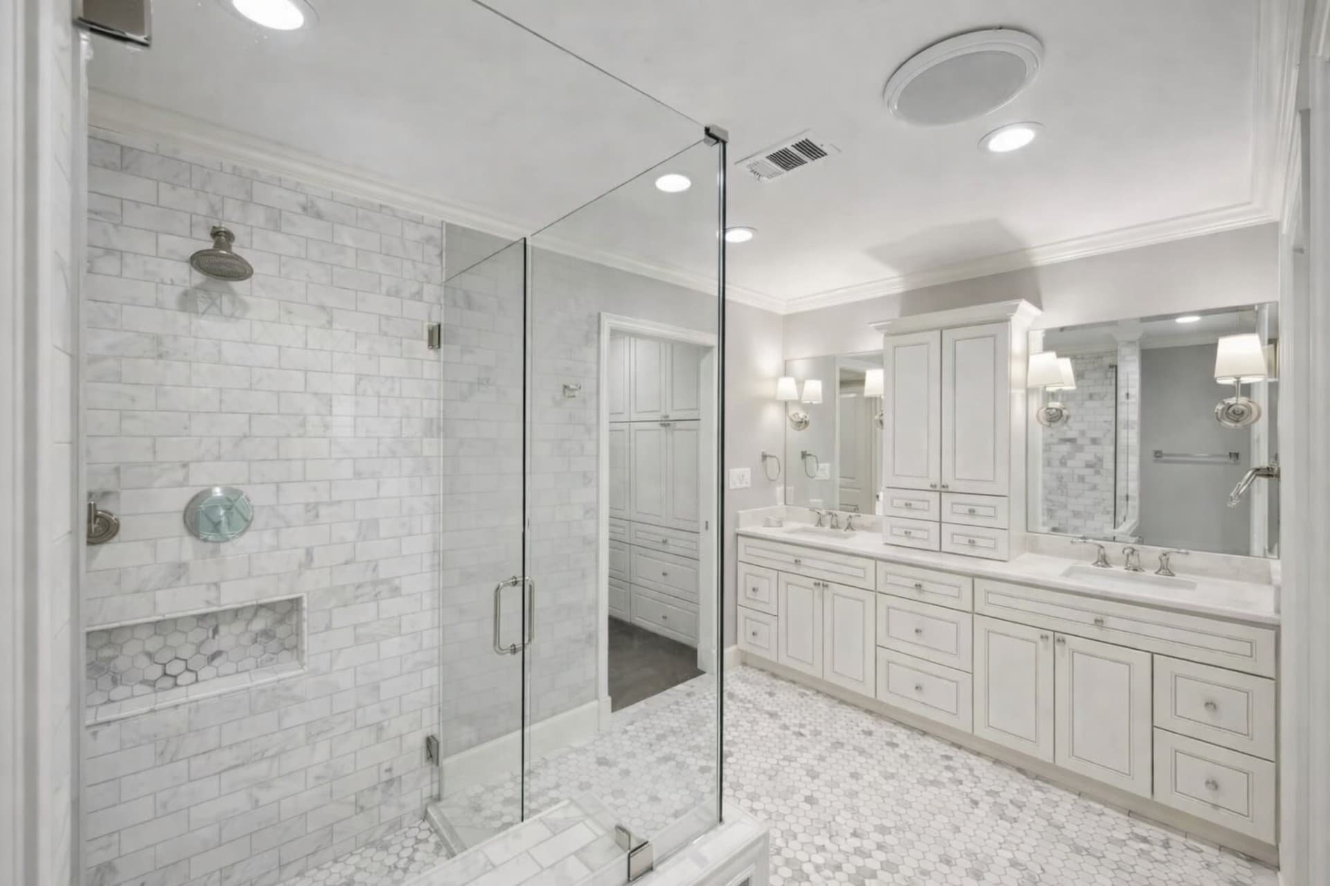 Custom Plano bathroom renovation with frameless glass shower and marble tile