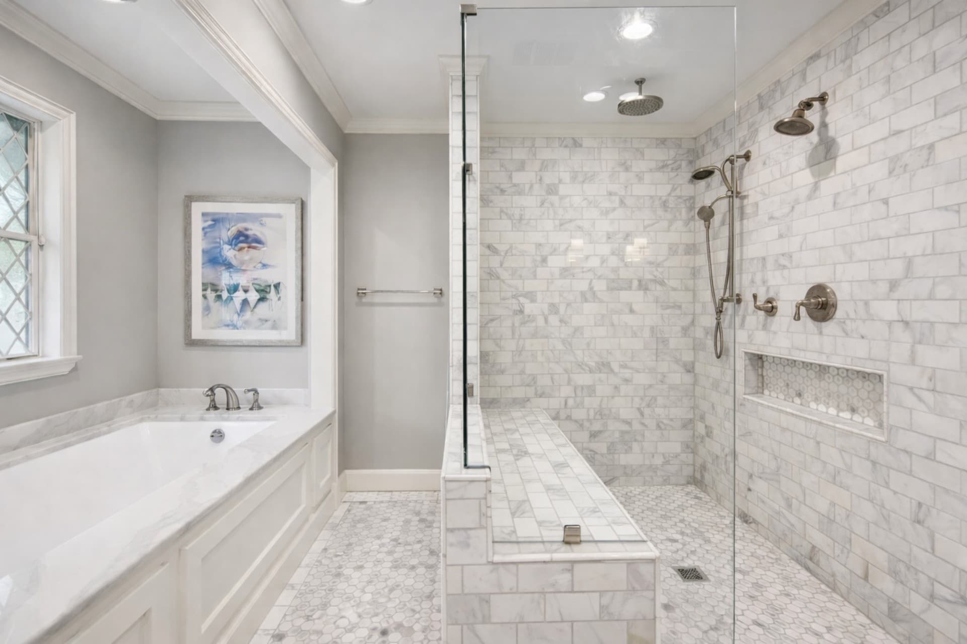Plano luxury bathroom remodel featuring marble walk-in shower and soaking tub