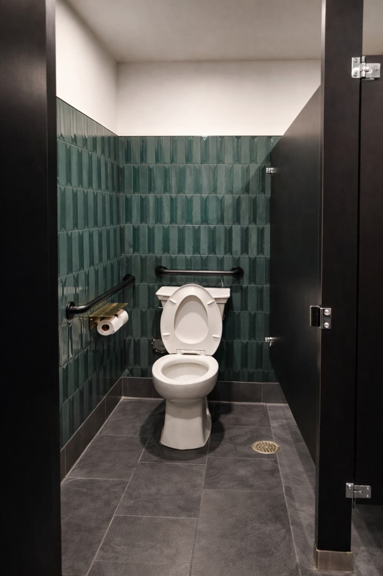 Prego Pasta House ADA restroom stall with green tile and slate flooring