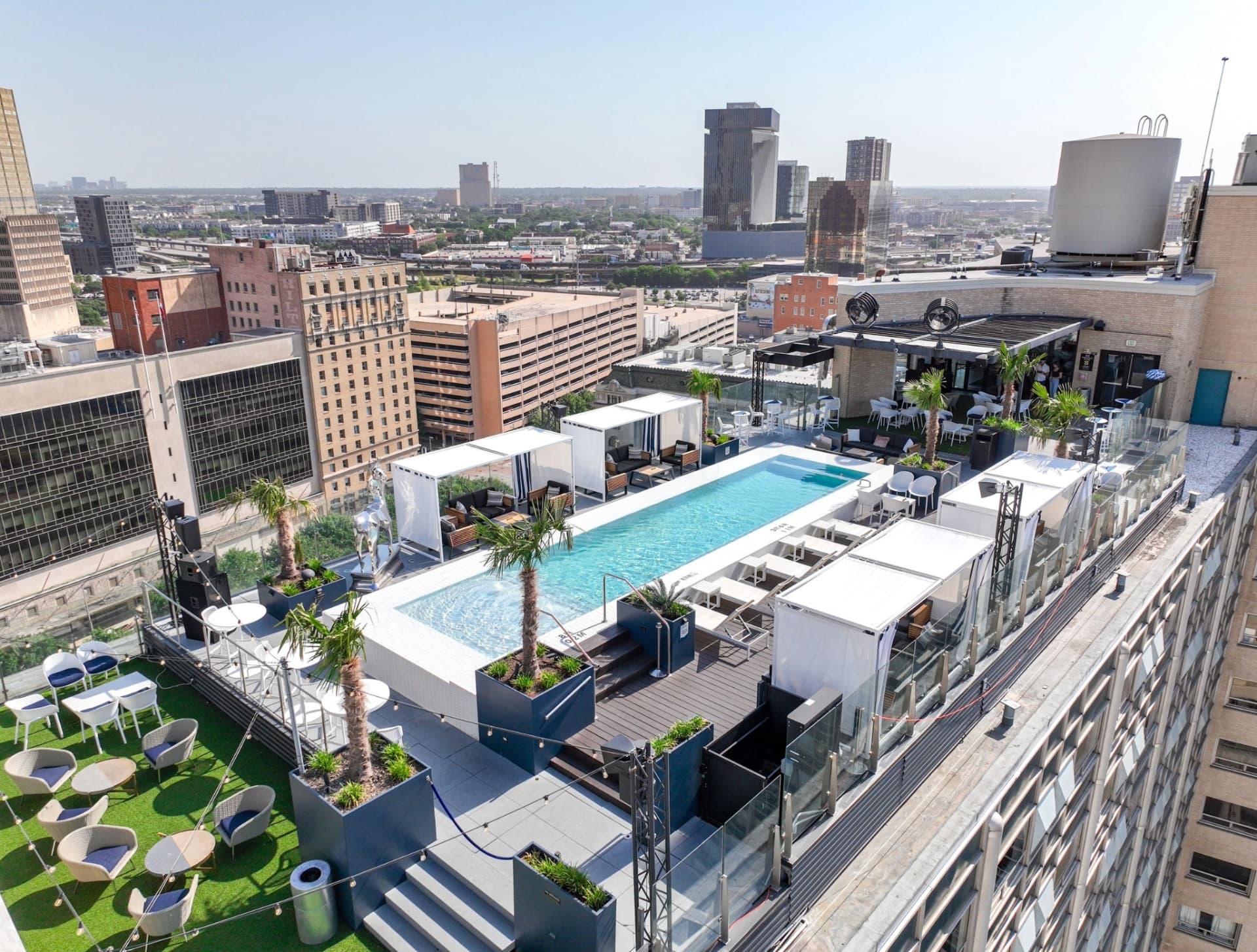 Waterproof rooftop pool aerial view with cabanas and landscaping Statler Hotel Dallas TX